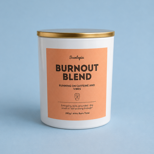 Candle labeled 'Burnout Blend' with a gold lid on a light blue background