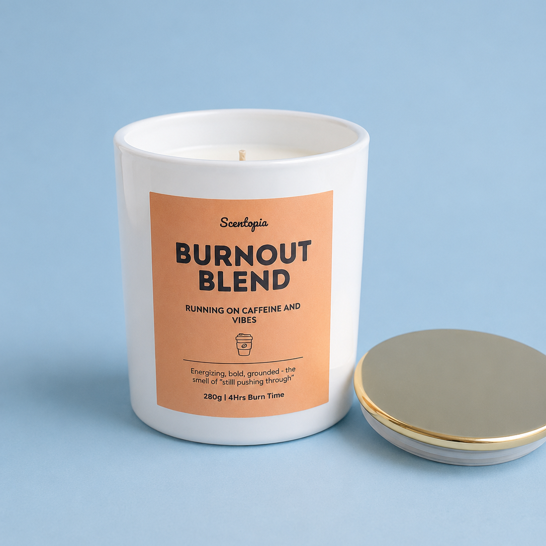 Candle labeled 'Burnout Blend' with a matching lid on a light blue background