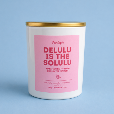 Candle with pink label on a blue background