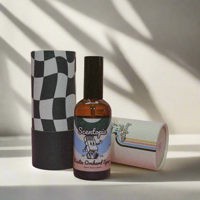 Room Spray bottle with checkered and colorful cylindrical packaging on a light background