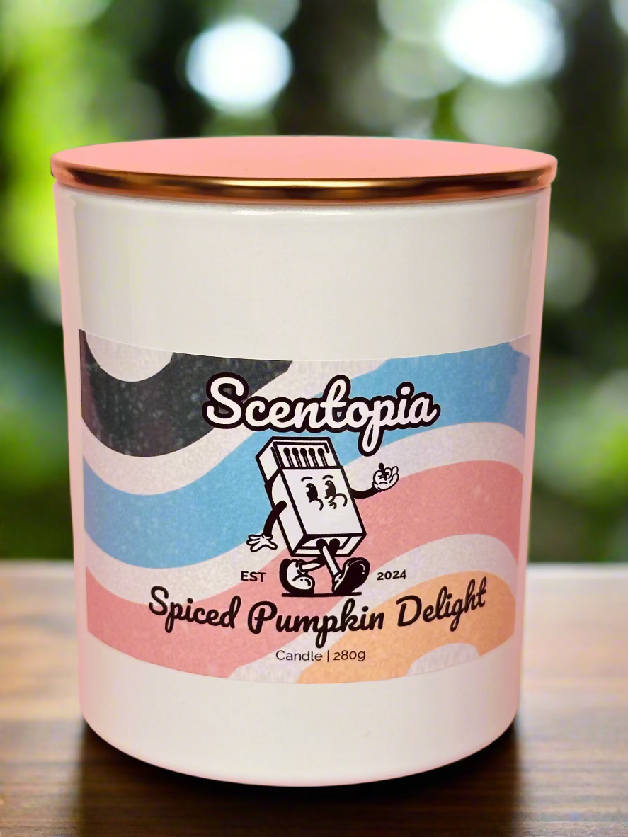 Scentopia Spiced Pumpkin Delight candle on a wooden surface with a blurred green background