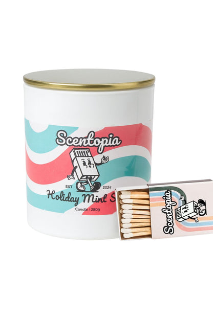 Scentopia candle with matches on a white background